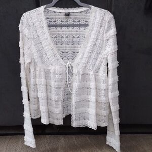 Off-white lace tie-front long-sleeve top with ruffle details.Shein, size medium